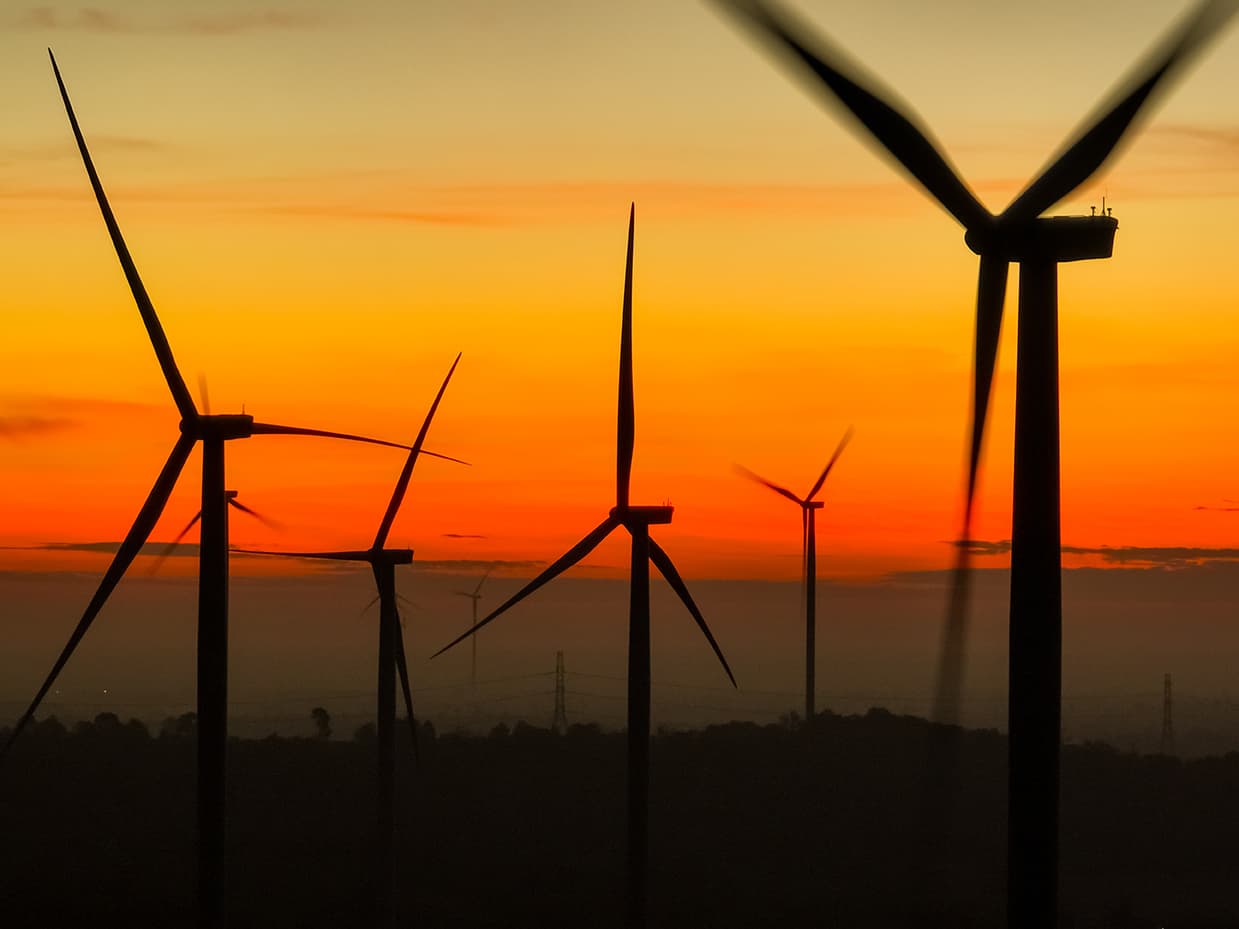 Wind farm field and sunset sky. Wind power. Sustainable, renewable energy. Wind farm field and sunset sky. Wind power. Sustainable, renewable energy.