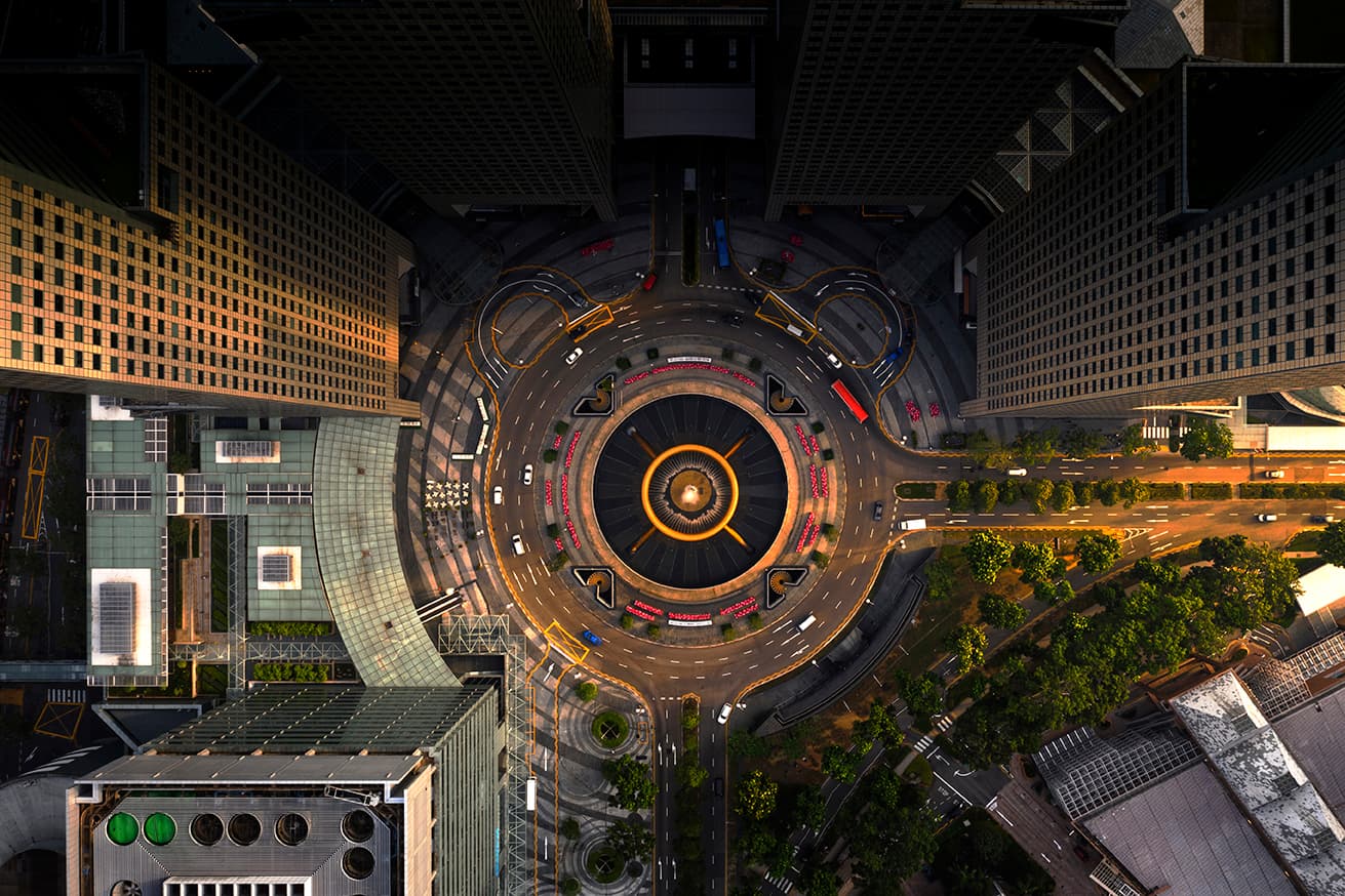 top down view of a city roundabout at night top down view of a city roundabout at night